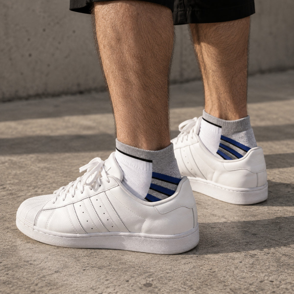 Adidas Mini Small Half Gray worn by a male model with white sneakers - Dravo lifestyle photo